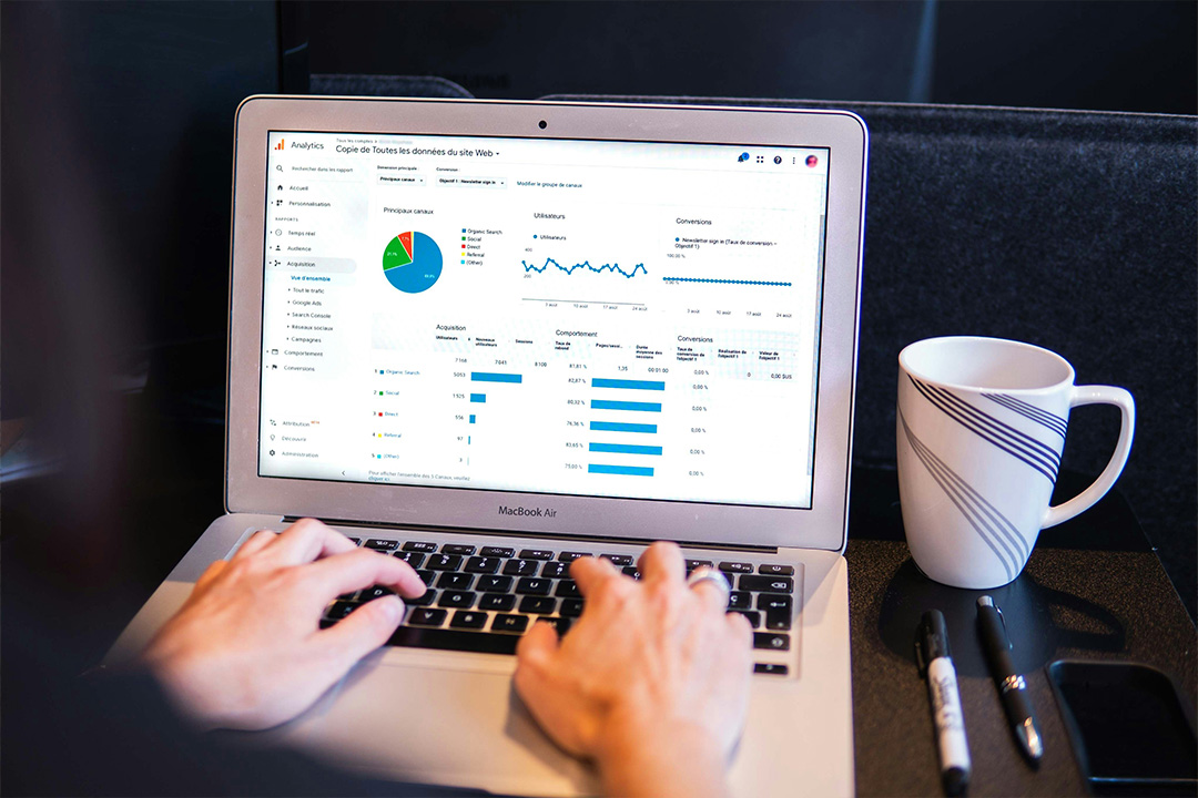 Search engine marketing dashboard on a laptop, showing data for paid search campaigns in digital marketing.