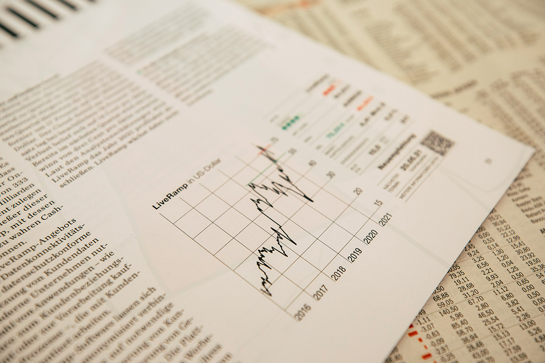 Notebook and charts on a desk, representing marketing strategy planning and customer journey mapping for films.